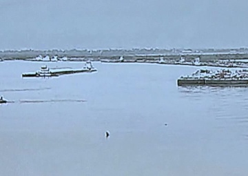 Tug capsizes next to barges in San Jacinto river