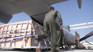 B-roll of JMSDF and Marines loading relief supplies into aircraft