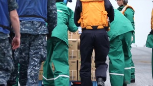 B-Roll of JMSDF loading supplies onto MV-22 Osprey for earthquake relief