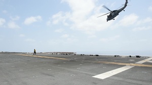 An MH-60S Sea Hawk takes off from USS Boxer (LHD 4)