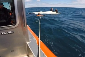 Wilmette Harbor rescues 3 from capsized vessel