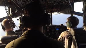 A Coast Guard Air Station Clearwater HC-130 Hercules aircrew searches west of Boca Grande, Florida, for a missing family on June 24, 2016.
