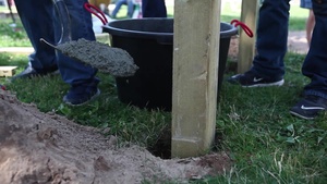 U.S. Marines with Saber Strike 16 build pull up bars in Latvian community