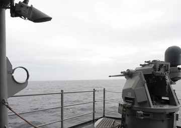 MK-38 25 MM machine gun system fires from amphibious assault ship USS Boxer (LHD 4) during an integrated live fire exercise
