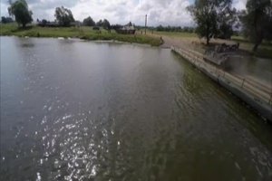 U.S. and Romanian armor crosses floating bridge (aerial footage)