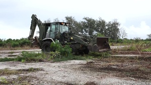 Seabee Clears Debris off Tinian Runway
