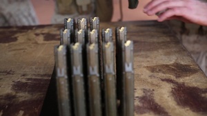 Marines and Aussie soldiers exchange weapons