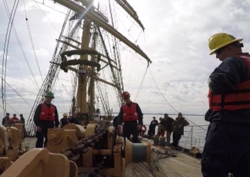 Eagle crewmembers set the anchor