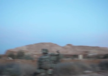 Coalition partners from the United Kingdom peform security patrol at Al Asad