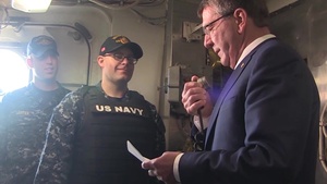 Carter Visits Troops Aboard USS Monterey, Gives Liberty Call