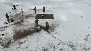 US Soldiers Ice Jump in Latvia