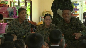 Cobra Gold 2017: U.S. Marine Corps Lance Cpl. Dominic Edwards interacts with children