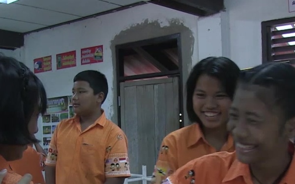 Cobra Gold 2017: U.S. Marine Corps Cpl. LaPresha Harris interacts with children at a local school