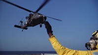 U.S. Army Helicopters Land on USS Greenbay