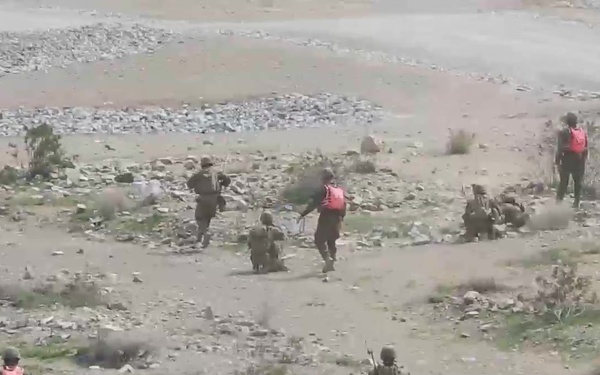 Gaining the initiative: Marines take down enemy combatants in urban environment (broll)