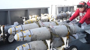 USS George H.W. Bush Sailors Move Ordnance on the Flight Deck