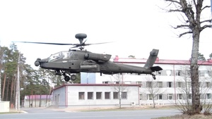Apache Attack Helicopter pilots brief multinational JTAC counterparts