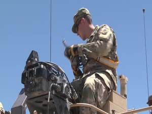 Mississippi Army National Guard Soldiers at the National Training Center install MILES gear. (Social Media)