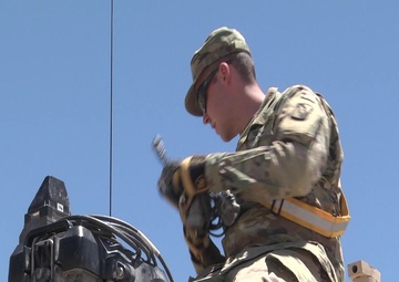 Mississippi Army National Guard Soldiers at the National Training Center install MILES gear. (Social Media)