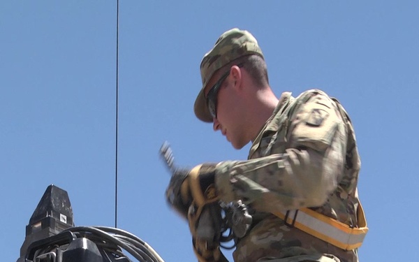 Mississippi Army National Guard Soldiers at the National Training Center install MILES gear. (Social Media)