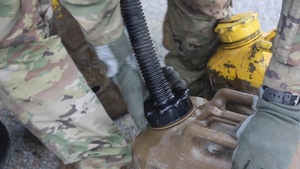 Paratroopers from Alpha Battery, 4th Battalion, 319th Airborne Field Artillery Regiment, 173rd Airborne Brigade, refuel the Humvees in support of Exercise Saber Guardian 2017
