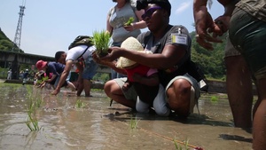 Station residents plant rice with Japanese locals