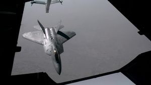 KC-10 Extender refuels F-22 Raptors