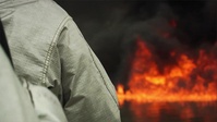 Aircraft Rescue Firefighters: Walking into Fire