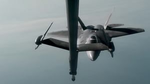 KC-10 Extender refuels F-22 Raptors