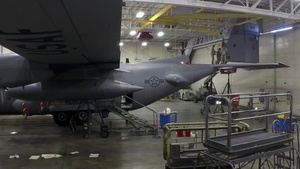 Airmen reattach tail to aircraft