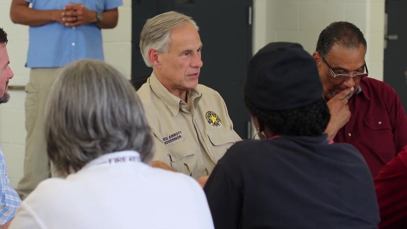 Governor Greg Abbott visits a food and water distribution point in Beaumont, Texas.