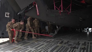 B-roll 2 of 3 of 101st Airborne Division (AASLT) Soldiers preparing HH-60 medevac Blackhawk helicopters for loading onto a C-5 Galaxy