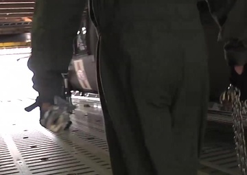B-roll 3 of 3 of 101st Airborne Division (AASLT) Soldiers preparing HH-60 medevac Blackhawk helicopters for loading onto a C-5 Galaxy