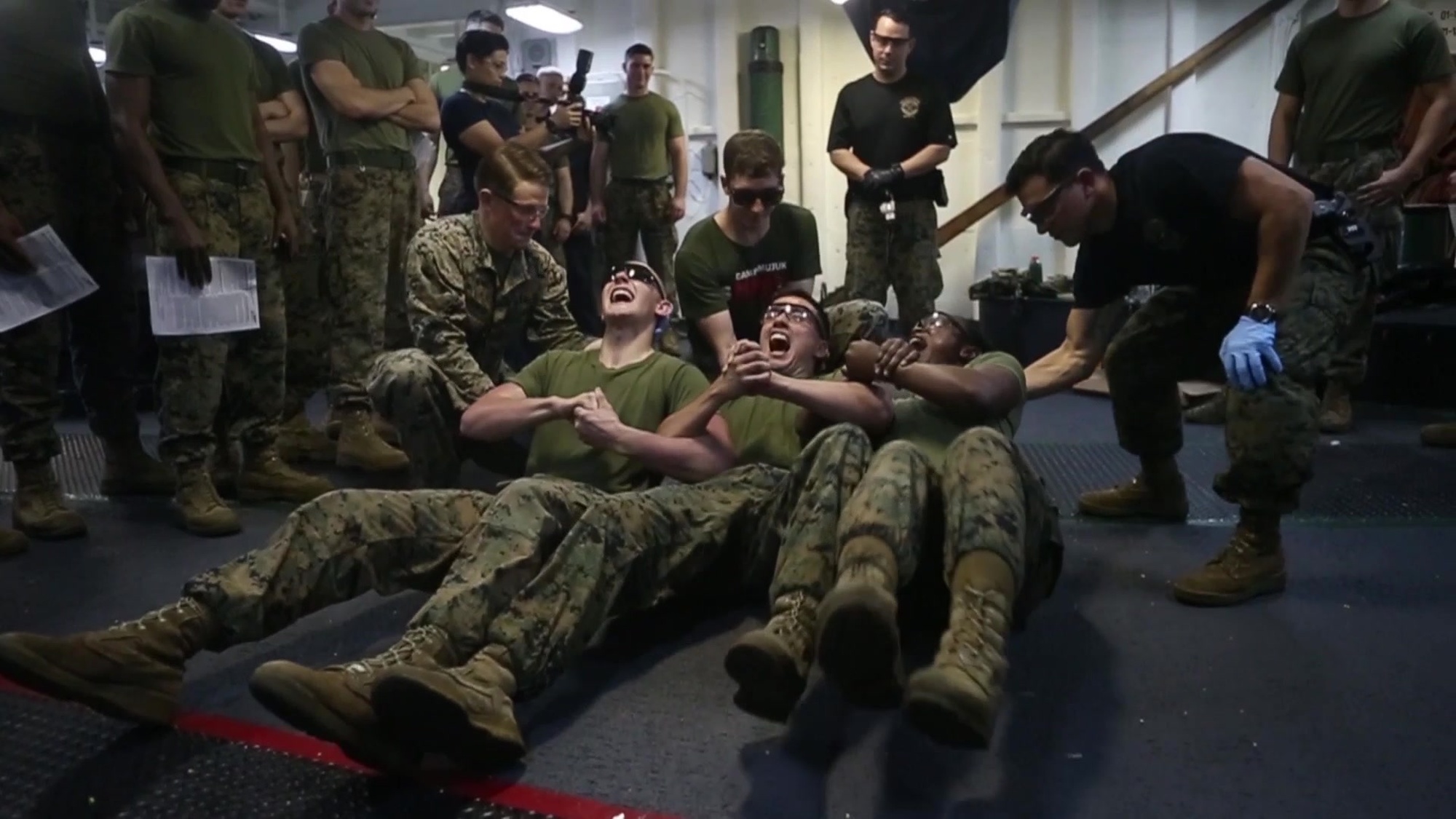 Marines and Sailors experience the jolt of 50-thousand volts course through their bodies during nonlethal weapons training aboard the USS Bonhomme Richard (LHD 6), underway in the Pacific Ocean, Sept. 14, 2017. Nonlethal weapons instructors with Combat Logistics Battalion-31’s Military Police Platoon trained Marines and Sailors from across the 31st MEU to use Tasers and other nonlethal weapons during security operations. A critical component of nonlethal weapons training is “exposure,” when trainees feel and experience the effects of nonlethal weapons, including Tasers. CLB-31 provides logistical support to all elements of the 31st MEU.