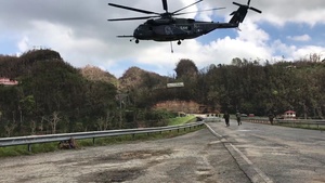 MH-53E Sea Dragon Helicopter Transports Barriers to Help Repair the Guajataca Dam