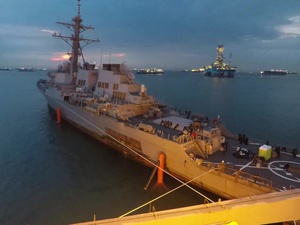 USS John S McCain being moved in Preparation for on Load to the Heavy Lift Vessel MV Treasure