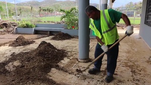 Local contractors clear pavement for water purification center in Canovanas Puerto Rico