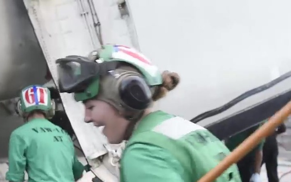 Sailors Wash an E-2C Hawkeye