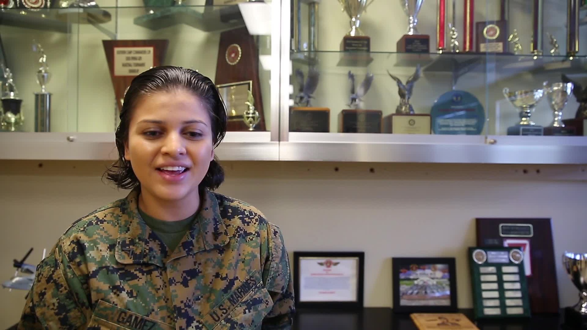 Lance Cpl. Jackelyn P. Gamez, from Alexandria, Virginia, sends Thanksgiving wishes to her friends and family back home. Gamez is a aviation Maintenance administrator for Marine Aviation Logistics Squadron 36, 1st Marine Aircraft Wing. (U.S. Marine Corps video by Alexia Lythos)