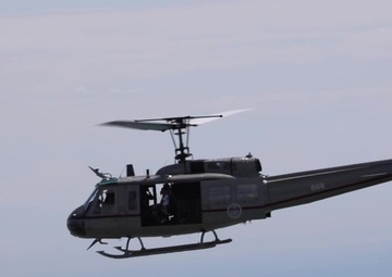 US Ambassador John D. Feeley and Leyda Díaz ride in a helicopter over Panama City, Panama