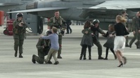 Sailors with Carrier Air Wing 5 touchdown, reunite with families (Package/Pkg)