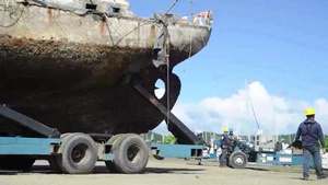 Hurricane Response Crews in Puerto Rico Move Wrecked Vessels Off Crane Barge