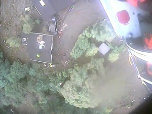 Coast Guard MH-65 Dolphin helicopter crew hoists mudslide victims in Santa Barbara County