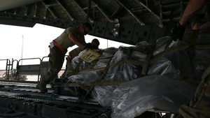 A C-17 crew loads cargo and performs rapid delivery