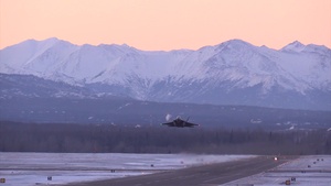 E-3, C-17, and several F-22s Taking Off