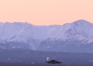 E-3, C-17, and several F-22s Taking Off