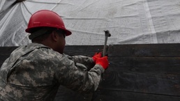 Ohio National Guard Soldiers help erect floodgates as flood waters rise in Southern Ohio