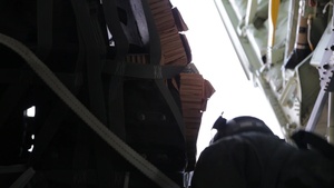 Alaska National Guard C-130J drops equipment, personnel to frozen Beaufort Sea