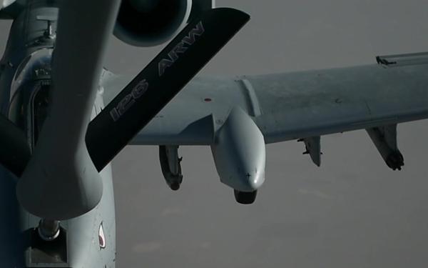 A KC-135 Stratotanker refuels A-10 Thunderbolt II's
