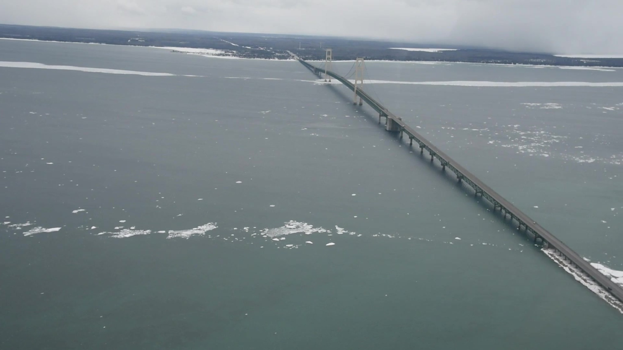 The Coast Guard conducts an overflight of the Straits of Mackinac in Michigan, April 6, 2018. Skim ice and water discoloration may appear as pollution from a distance. However, Coast Guard pollution investigators have not identified any signs of a sheen following a mineral oil discharge from underwater utility cables that occurred, April 3, 2018.  (U.S. Coast Guard video by Petty Officer 3rd Class Ryan Hogan).